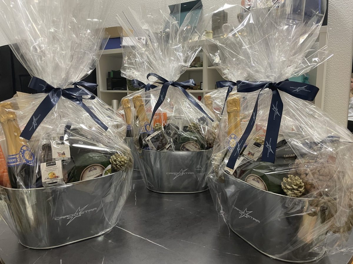 Branded Christmas gift hampers with logo ribbons and printed metal buckets